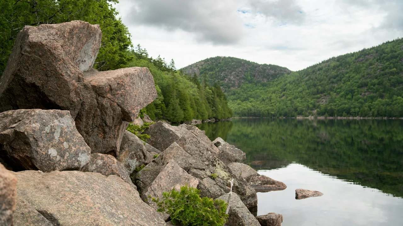 Mountains and trees reflected in Jordan Pond, Acadia, Maine; landscape photograph